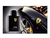 Frasco de perfume Ferrari Black Masculino Eau de Toilette 125ml ao lado de um carro preto da Ferrari com roda destacada.