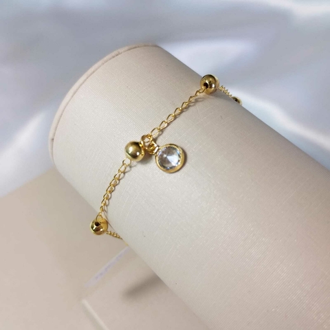 Pulseira de bolinhas com pingente de cristal