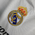 camisaretrorealmadridhome10-11mangalongamasculinaadidasbrancacomdetalhesemazul