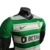 camisa-sporting-lisboa-i-22-23-jogador-nike-masculina-verde-com-detalhes-em-branco-e-preto