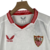 kit-infantil-sevilla-i-castore-23-24-branco-com-detalhes-em-vermelho