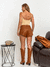 Shorts Kauana couro eco cadarco tachas