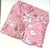 Short rosa con flores blancas