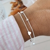 PULSERA DOBLE CORAZÒN Y BOLITAS