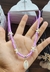 Colar de miçanga lilas com estrela e búzio