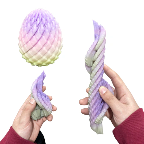 Huevo de Dragón Telescópico Mágico (Fidget Toy Antiestrés) - Multicolor BRILLA EN LA OSCURIDAD