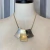 Colar Dourado Pingente Prata Onix na internet