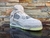 Nike Air Jordan 4 KAWS en Gris - comprar en línea