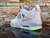 Nike Air Jordan 4 KAWS en Gris en internet