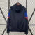 Jaqueta Corta Vento Barcelona Com Capuz Zíper Masculina Nike - Preta com detalhe Azul e Vermelho - comprar online