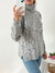 Sweater poleron rombo y tajos Rutherford