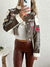 Imagen de Campera importada de cuerina con bordados Tavush