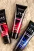 Tres tubos de lubricantes anales Sexitive: Premium Relaxing, Intensity y Supreme Retardante, sobre una superficie suave.