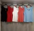 REGATA COM BOTÃO VERMELHO