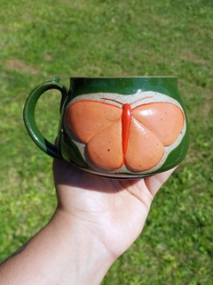 Caneca verde borboleta laranja na internet