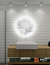 Modern round LED mirror in a stylish bathroom setting, featuring a luminous glass design and sleek white walls.