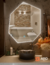 Espejo led ARD Glanz HeptaGlow en forma octagonal, con luz ajustable en tres tonos, instalado en un baño moderno.