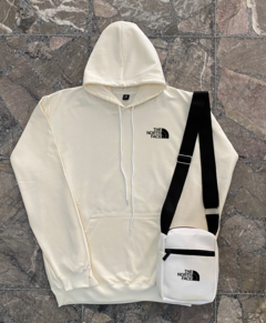 Buzo TNF + bandolera