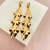 Brinco longo martelado - banhado a ouro 18k - T - comprar online