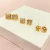 Trio de brincos trevos cravejados - banhado a ouro 18k - T - comprar online