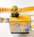 Carimbo e tirante Minion careca