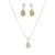 Conjunto de semijoias com brinco e colar em formato de gota cravejados de zircônias, em tom dourado.