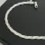 Pulseira trançada em prata 925 com três fios, destacando seu brilho e elegância.