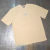 REMERA "DESERVES" BEIGE