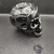 Calavera negra con decoración sobrecubierta - buy online