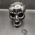 Calavera negra con decoración sobrecubierta - online store