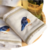 Toalha branca com faixa branca bordada pássaro azul - comprar online