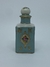 PERFUMEIRA AZUL COM TAMPA E DETALHES EM DOURADO E FLORES - comprar online