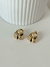 Aros triángulo lineas acero dorado. - comprar online
