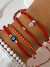 Pulsera roja cristales y bolitas de plata en internet
