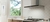 Campana Tst Colhue de 60 cm en acero inoxidable instalada en una cocina moderna con ventana y fogones.