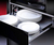 Calientaplatos Teka Cpel 15 Inox de 60 cm con platos blancos apilados en un cajón.