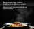 Plato de pasta humeante con salsa, presentado en un plato negro, ilustrando el uso de un calientaplatos Teka.
