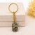Chaveiro Dourado com Pirita Natural Rolada – Prosperidade e Proteção Energética - comprar online
