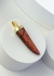 Pingente Dente Goldstone Marrom Banho Ouro - comprar online