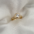 Anel Solitário Oval Cravejado Banhado a Ouro 18k e Ródio Branco na internet