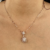 Conjunto Esfera Pendurada com Pequeno Ponto de Luz Banhado a Ouro 18k - loja online