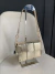 Bolsa Baguette/Tiracolo Tetê Dourada - comprar online