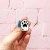 Pin patita negra esmaltado