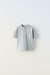 Remera c/botones y bolsillo GRIS Zara
