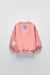Buzo CORAL FLORES c/friza ZARA en internet