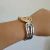 Pulsera brazalete CIRRA, de acero