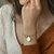 Pulseira elo Português, com pingente de São Bento. Banhado a Ouro 18K