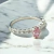 Anel Solitário Cravejado Oval Rosa - comprar online