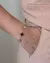 PULSEIRA INSPIRAÇÃO 5 TREVOS 2 em 1 - PRETA E LADO ZIRCÔNIA DOURADA na internet