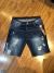 Bermuda jeans azul escura com detalhes rasgados da City Denim86